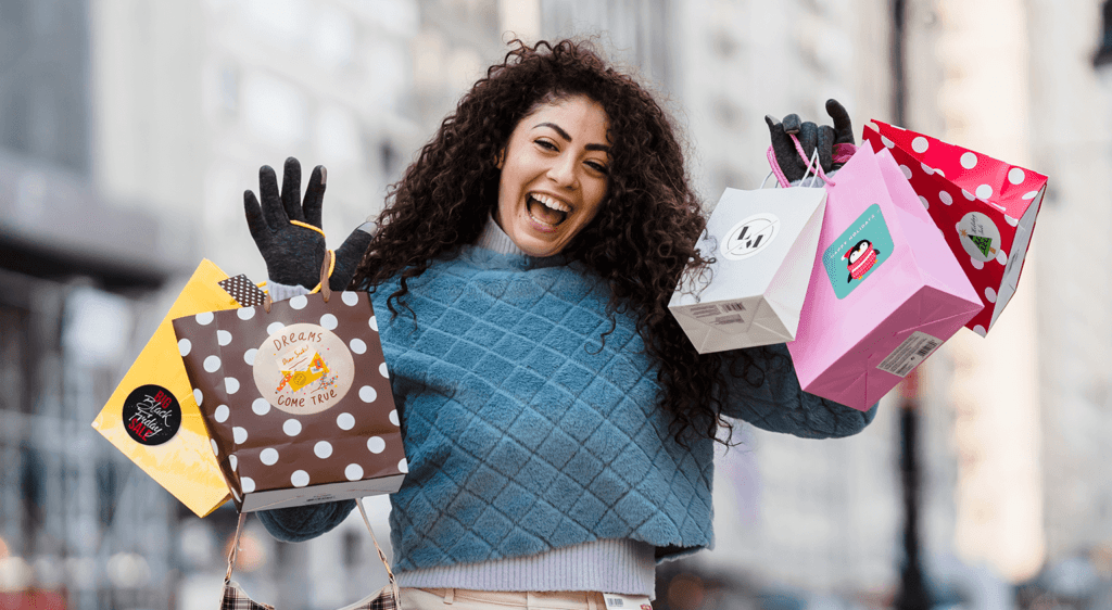 woman holding multiple gift bags