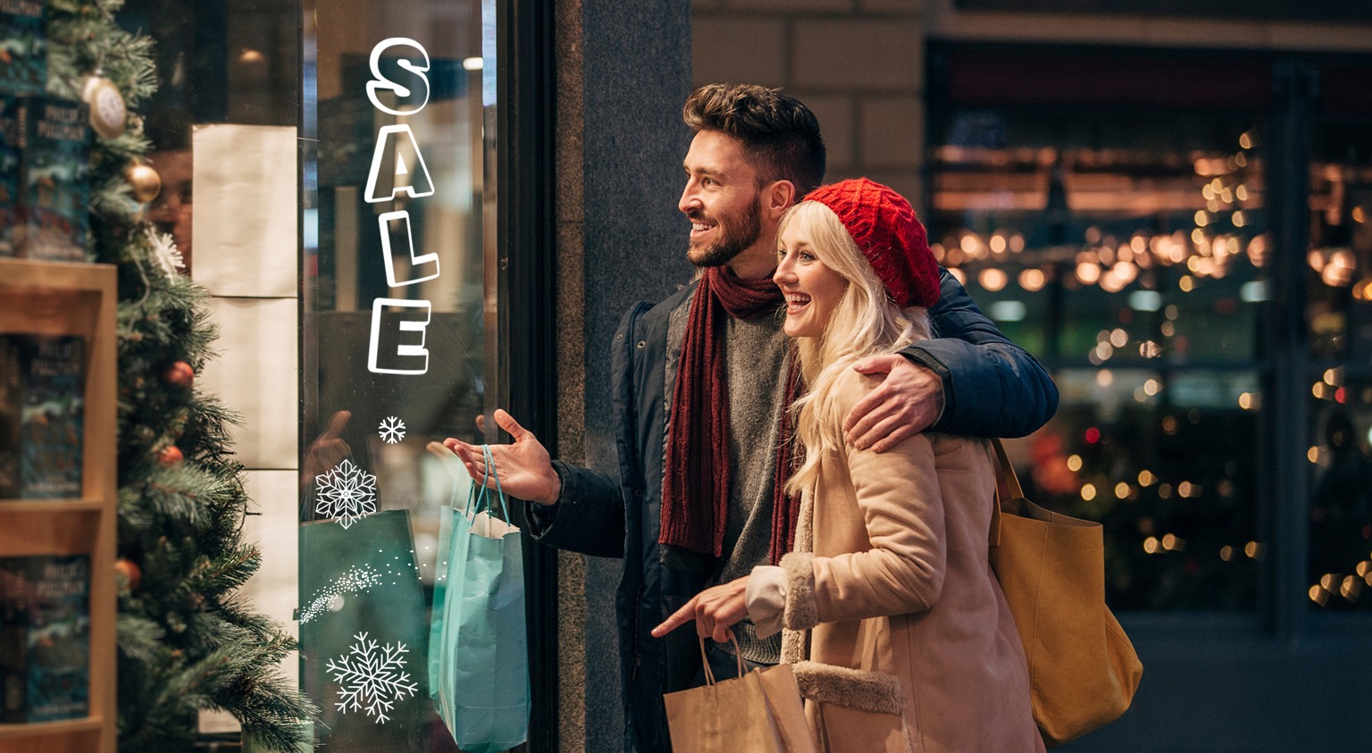 Holiday window storefront signage