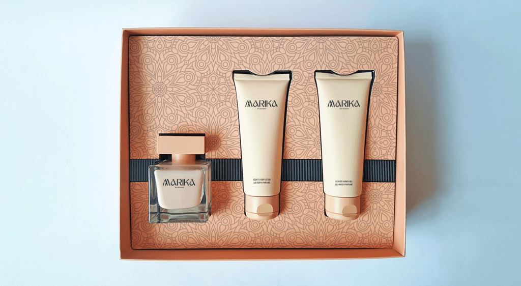 Image shows a luxury makeup brand with luxury package design. Foundation makeup is packages carefully and neatly in a peach coloured box, portrayed without a lid to view the products inside.